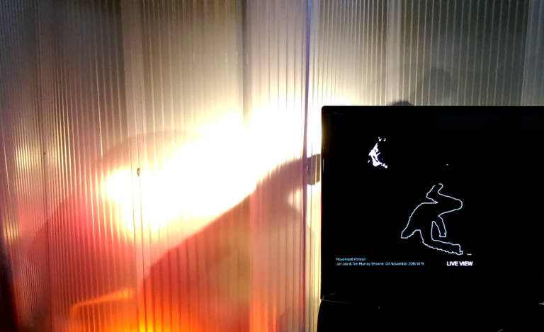 Movement Alphabet by Jan Lee and Tim Murray-Browne. At GAS Station London, audience view of a participant creating their movement portrait within the interaction pod through a process akin to a digital calligraphy of the whole body.